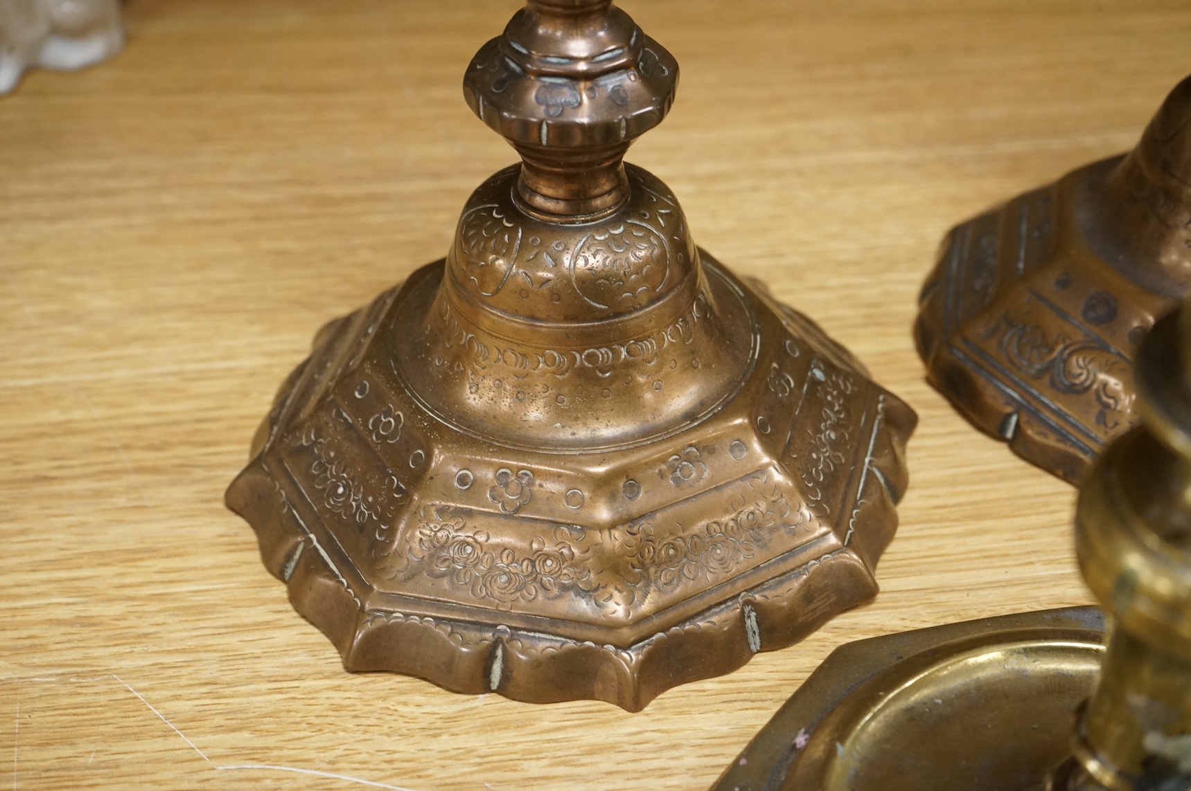 A group of period brass candlesticks, the majority 18th century